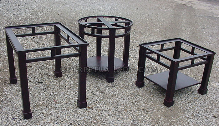 grouping of steel table frameswith red wax patina and no tops
