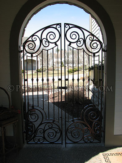 Wrought iron double gate, nodes and scrolled iron.