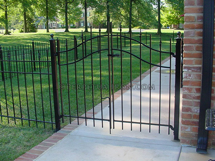 Arched double gate with finials, wrought iron.
