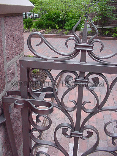 Iron gate, detail of 25.3, hand wrought iron, silver metal coating.