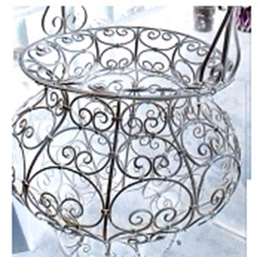 Large scale, old decorative iron garden basket with many scrolls.