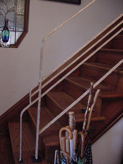 Art deco interior staircase rail with minimalist styling.