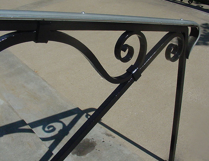 Detail of old iron 9.1. A handrail image of a church railing  with scroll design.