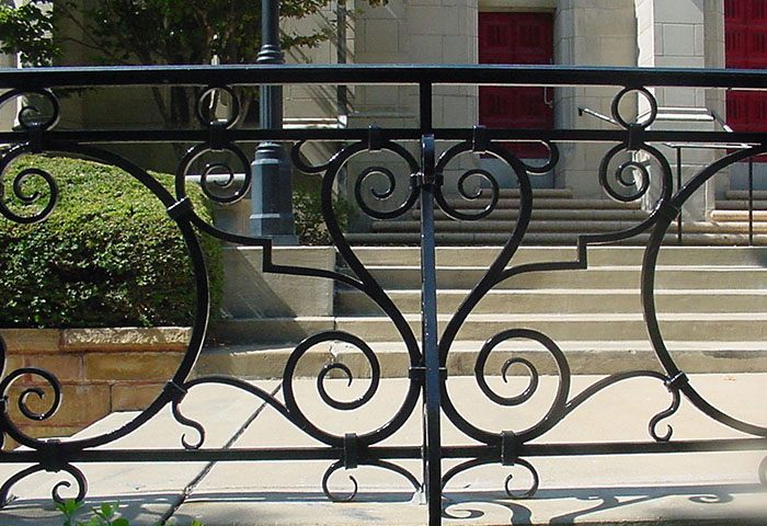 detail of 2.0 a rivetted iron porch railing.