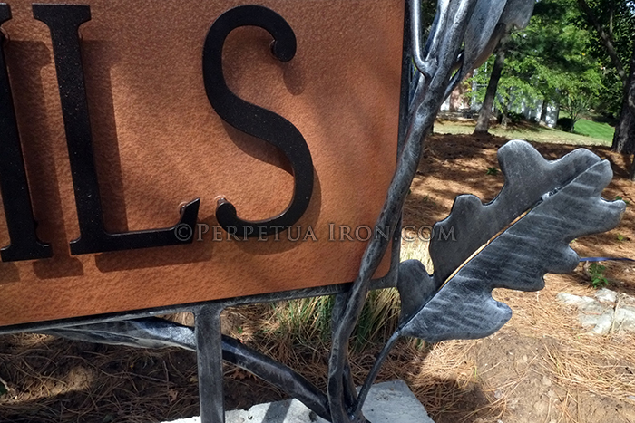 Detail of subdivision sign with sculptural elements.