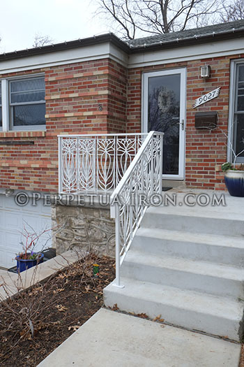 Trellis art designs porch railing with lotus motif.